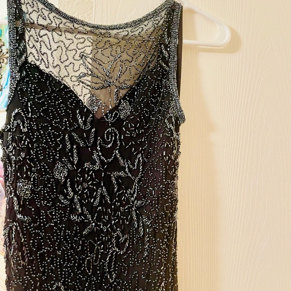 A gorgeous mid length beaded dress by Scala. - Picture 5 of 11